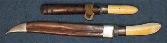 Two Burmese ivory handled dha, late 19th/early 20th century, 57cm (22.4in.) & 35cm (13.8in.)